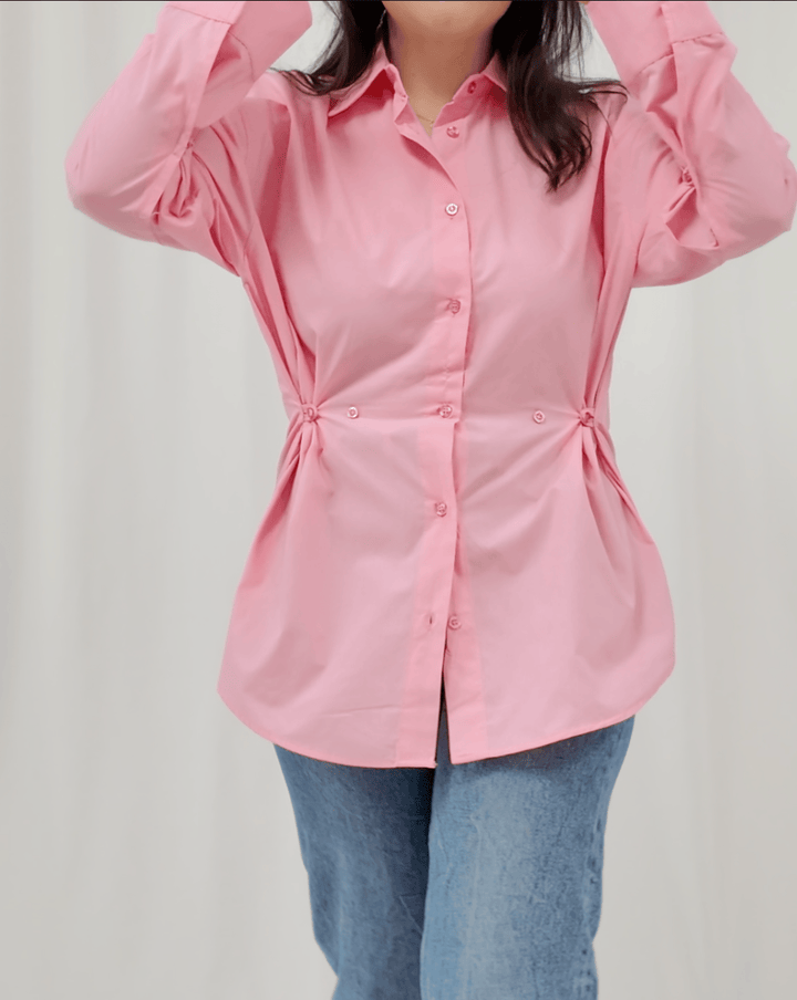 	Close-up of fabric and waist buttons on Petal Poise shirt by INNAM